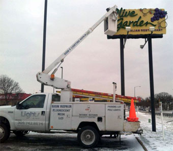 Repairing a neon sign at Olive Garden in Peoria