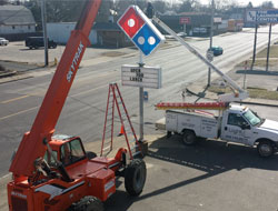 Installing a new Domino's road sign