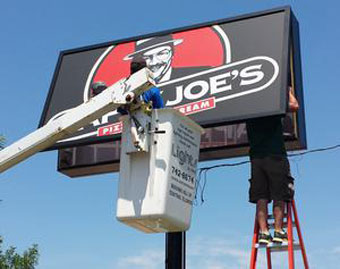 Repairing a fluorescent Happy Joe's sign